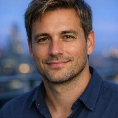 Man in late 30s, dark blonde hair, brown eyes, relaxed expression